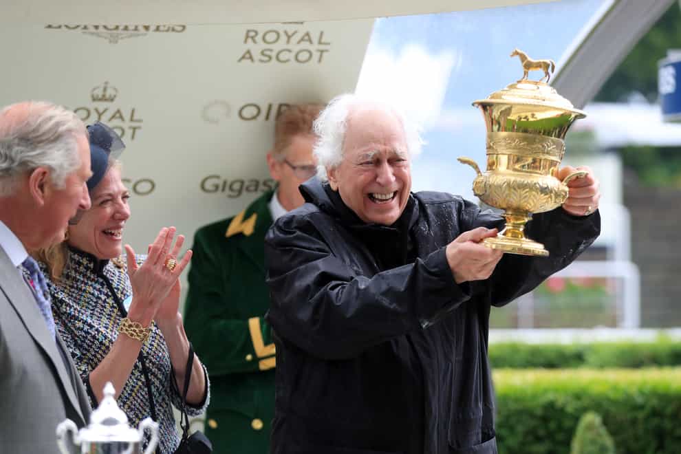 Sir Evelyn de Rothschild celebrates after winning the Prince of Wales’s Stakes with Crystal Ocean (Mike Egerton/PA)