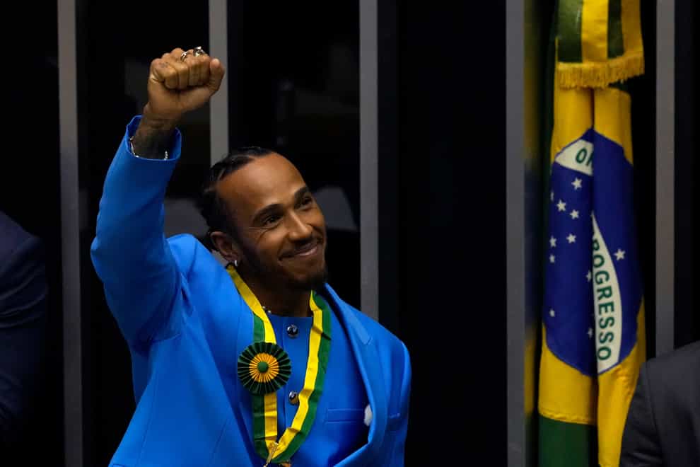 Lewis Hamilton acknowledges the crowd during a ceremony to receive the title of Honorary Citizen of Brazil at the Chamber of Deputies in Brasilia. (Eraldo Peres/AP)