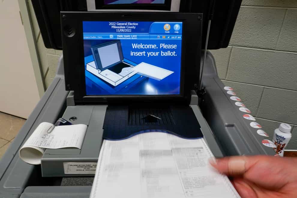 A ballot is submitted during the US midterm election (Morry Gash/AP)