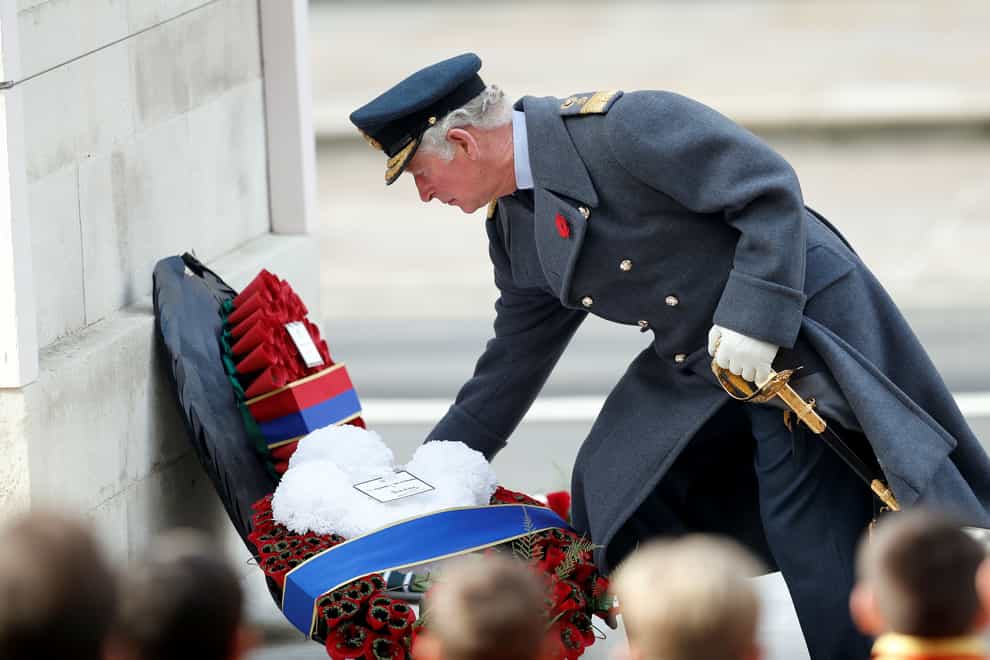 The King, as the Prince of Wales, lays a wreath during Remembrance Sunday service at the Cenotaph (Peter Nicholls/PA)