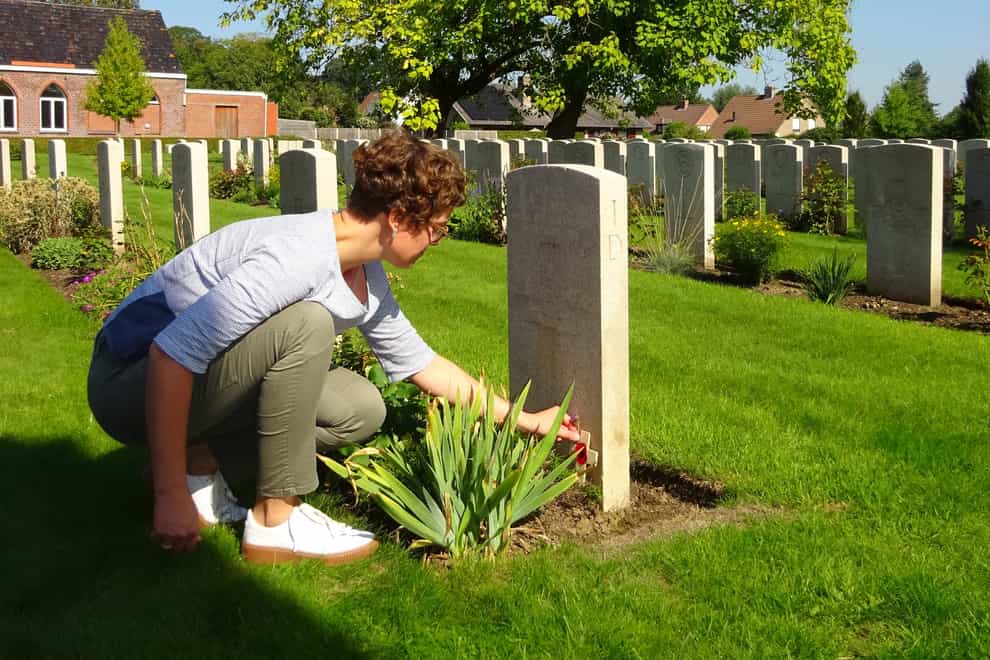 Marijke Vandevyvere visits the grave of James Lawson Mitchell in Belgium (Church of Scotland/PA)
