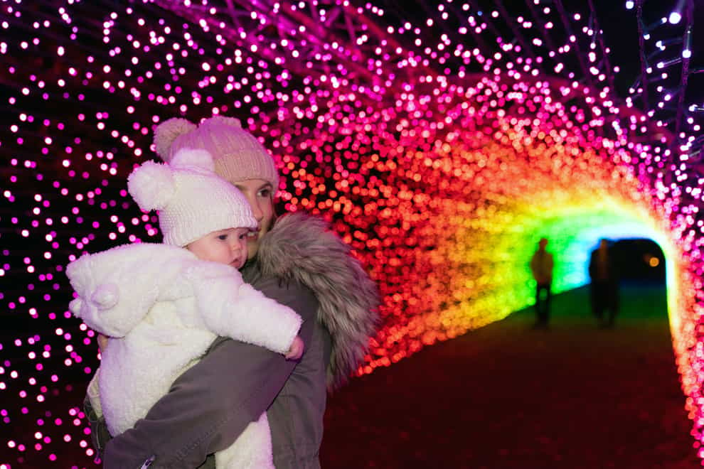 Paige Dawson and her four-month-old daughter Summer during the preview of Luminate Sandringham, the Sandringham Estate winter light trail, in the Royal Park at Sandringham House, Norfolk. Picture date: Thursday November 10, 2022.