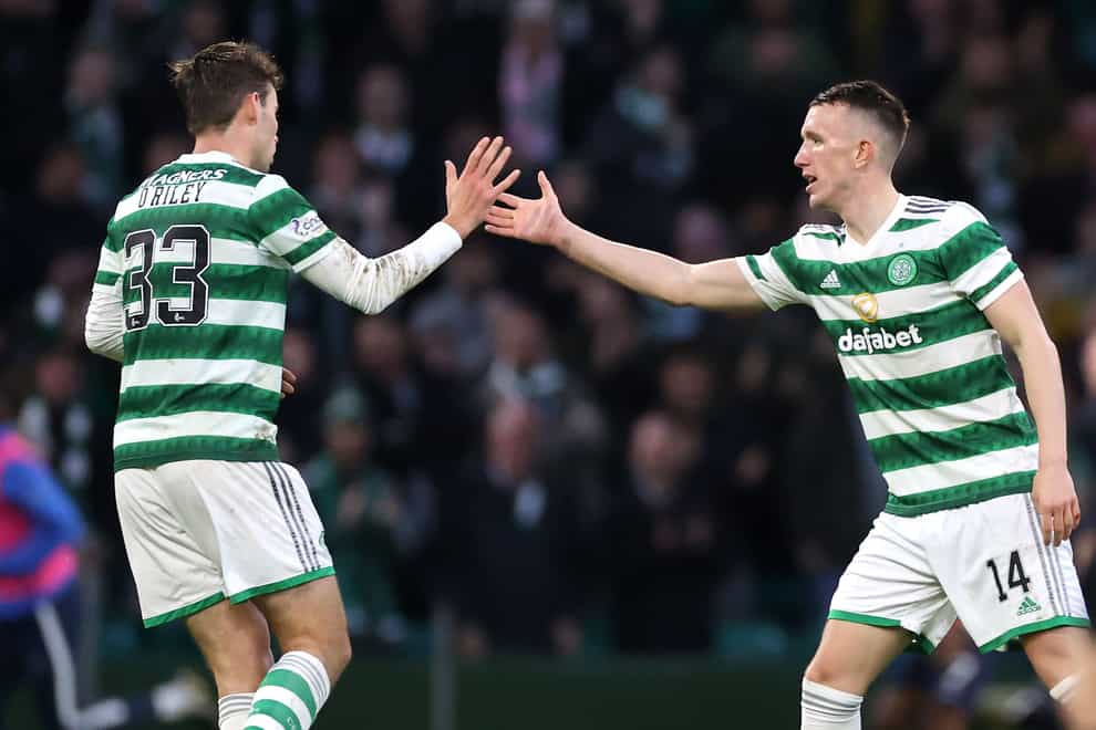 Matt O’Riley, left, congratulates David Turnbull after the Scotland midfielder launched Celtic’s comeback (Steve Welsh/PA)