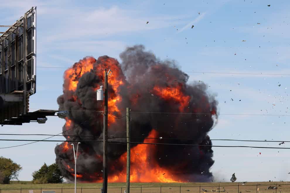 A historic military plane crashes after colliding with another plane during an airshow at Dallas Executive Airport (Nathaniel Ross Photography via AP)