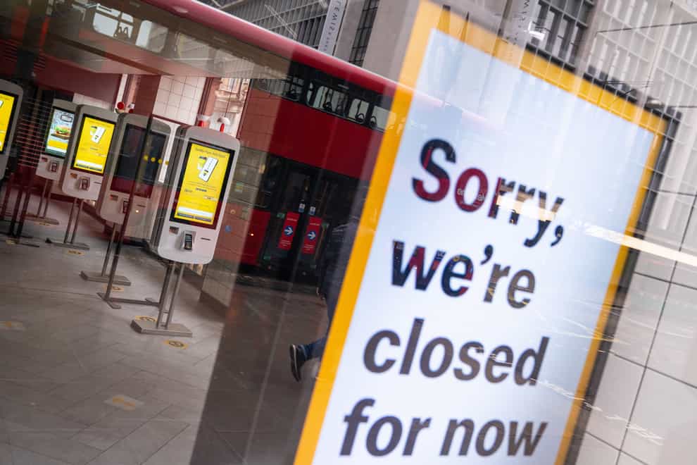 A closed sign in the window of a branch of McDonalds on Oxford Street in London (Dominic Lipinski/PA)