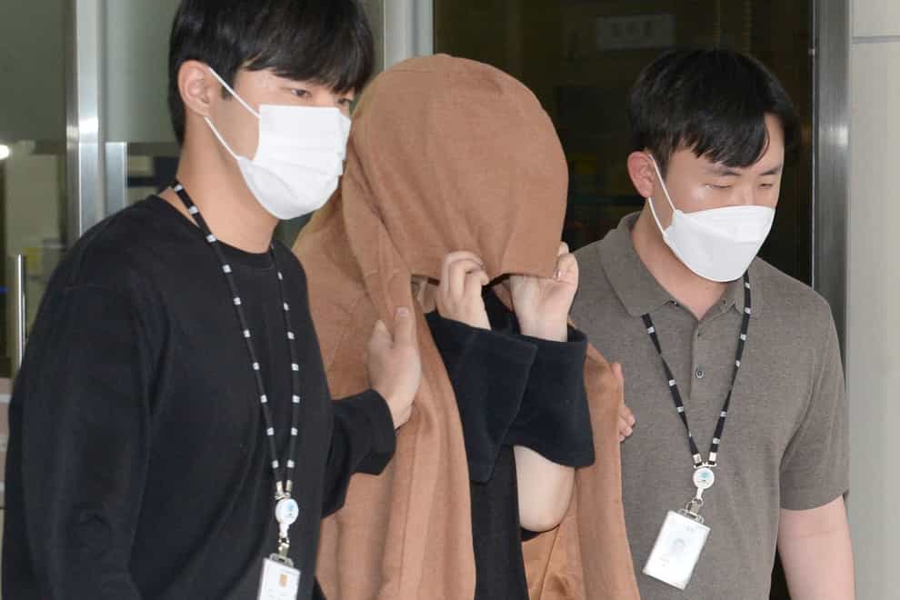 A South Korean court has approved the extradition of the 42-year-old woman facing murder charges in New Zealand over her possible connection to the bodies of two long-dead children found abandoned in suitcases in August (Bae Byung-soo/Newsis via AP/PA)