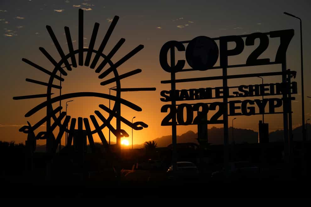 The sun sets outside the venue of the Cop27 UN Climate Summit, in Sharm El-Sheikh, Egypt (Peter Dejong/AP)