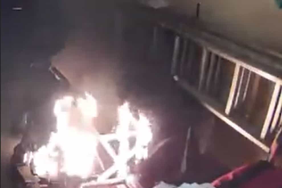 The video shows the moment that the battery caught fire ( Hampshire Fire and Rescue Service/PA)
