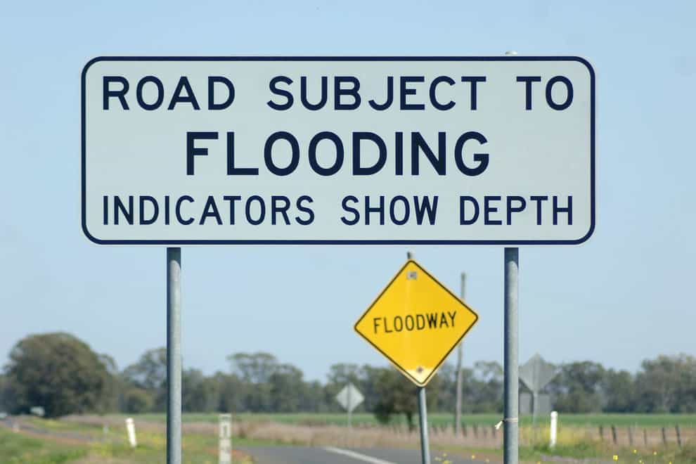 A flooding sign in Queensland, Australia (Peter Righteous/Alamy/PA)