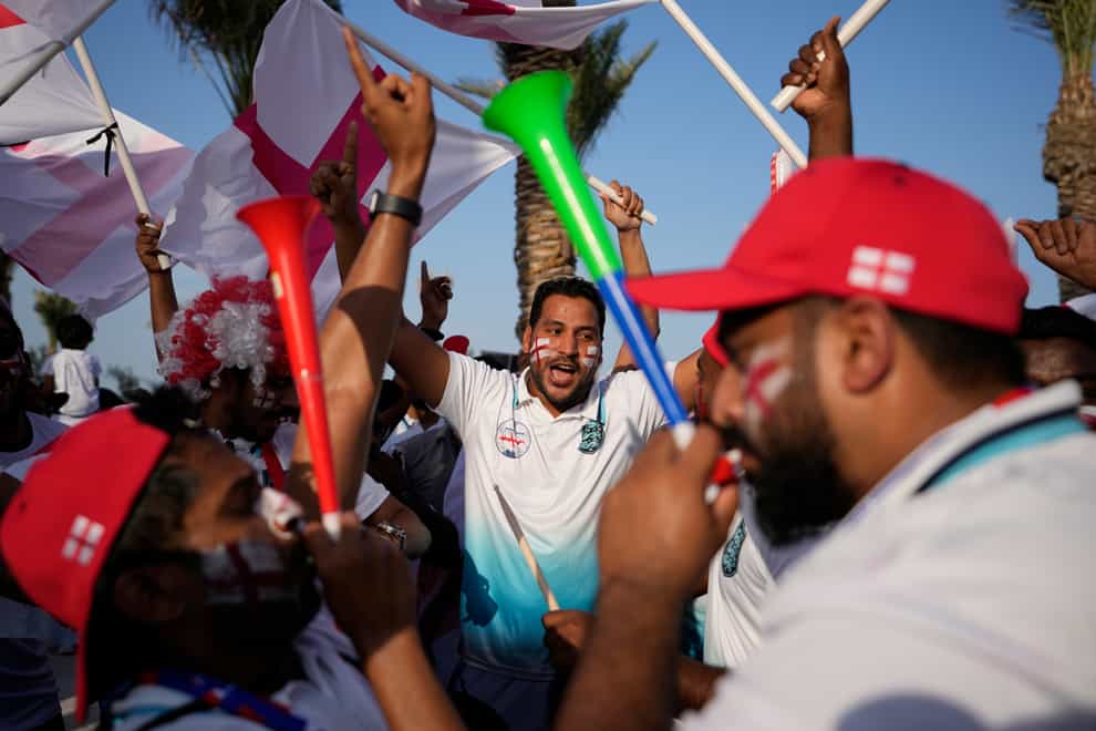 England fans cheer at flag plaza in Doha, Qatar, Friday, Nov. 11, 2022. Final preparations are being made for the soccer World Cup which starts on Nov. 20 when Qatar face Ecuador. (AP Photo/Hassan Ammar)