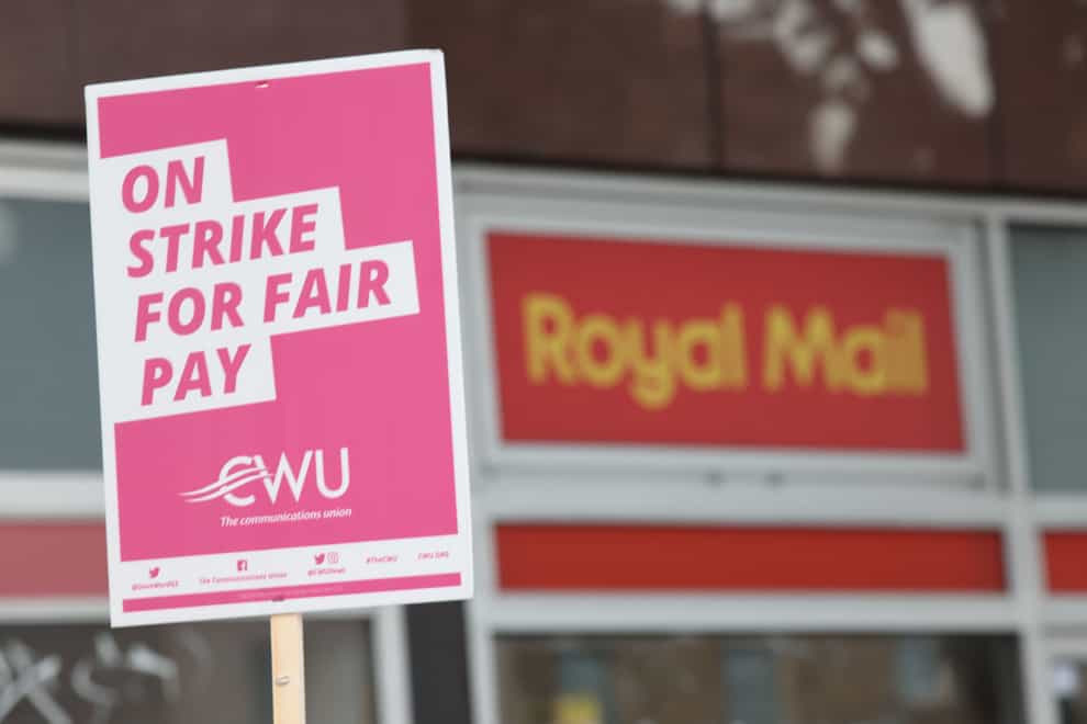 Royal Mail has asked the Government for an early move to cut its letter service to five days a week as it unveiled hefty losses after a hit from crippling strike action (PA)
