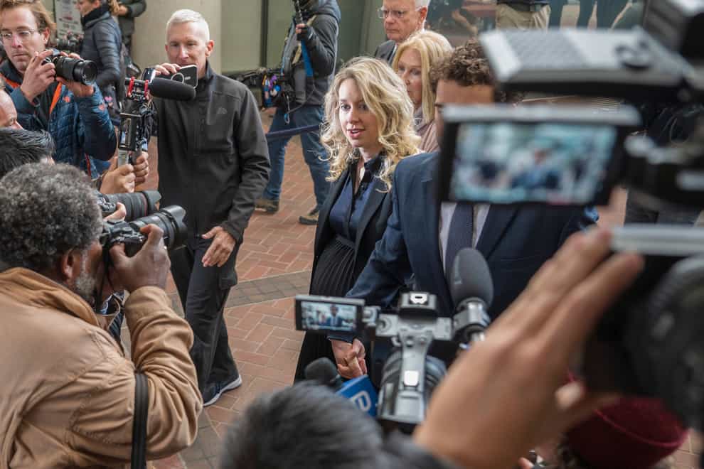 Theranos founder and chief executive Elizabeth Holmes walks into federal court in San Jose, California (Nic Coury/AP)