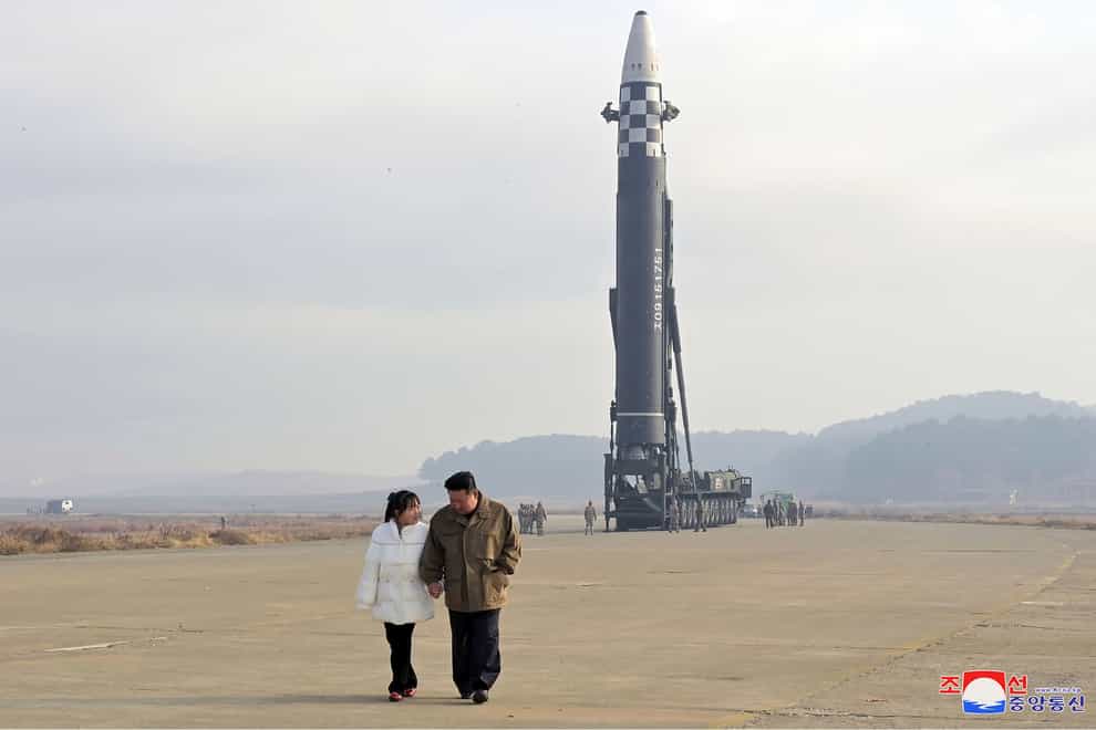 Kim Jong Un, right, and his daughter inspect the site of a missile launch at Pyongyang International Airport (Korean Central News Agency/Korea News Service/AP)