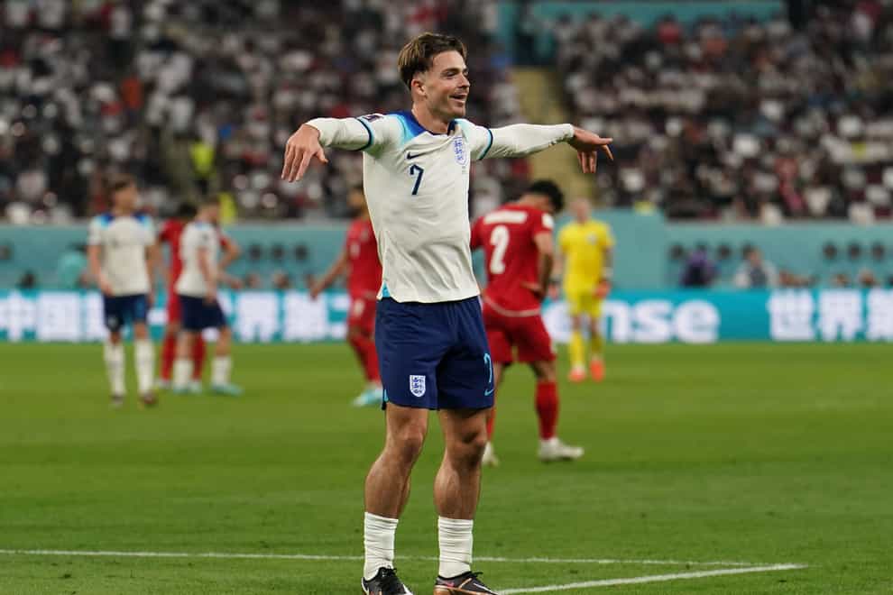 England’s Jack Grealish celebrates scoring the side’s sixth goal against Iran in the World Cup group game (PA)