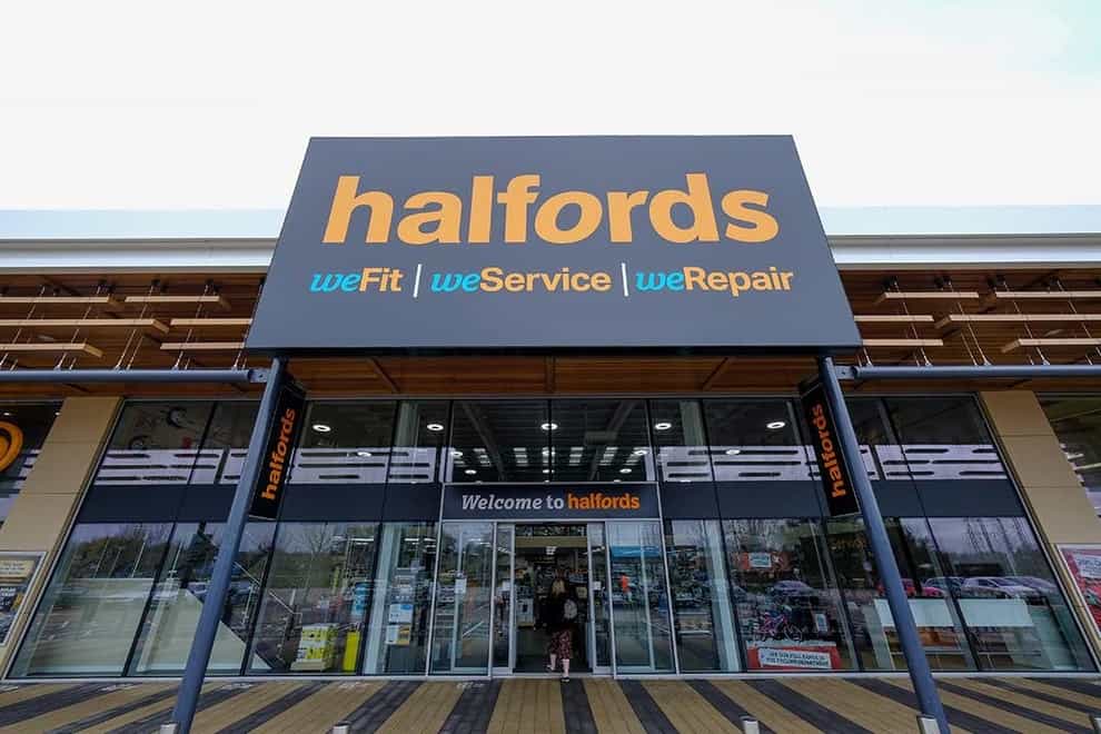 Retailer Halfords has seen interim profits halve (Halfords/PA)