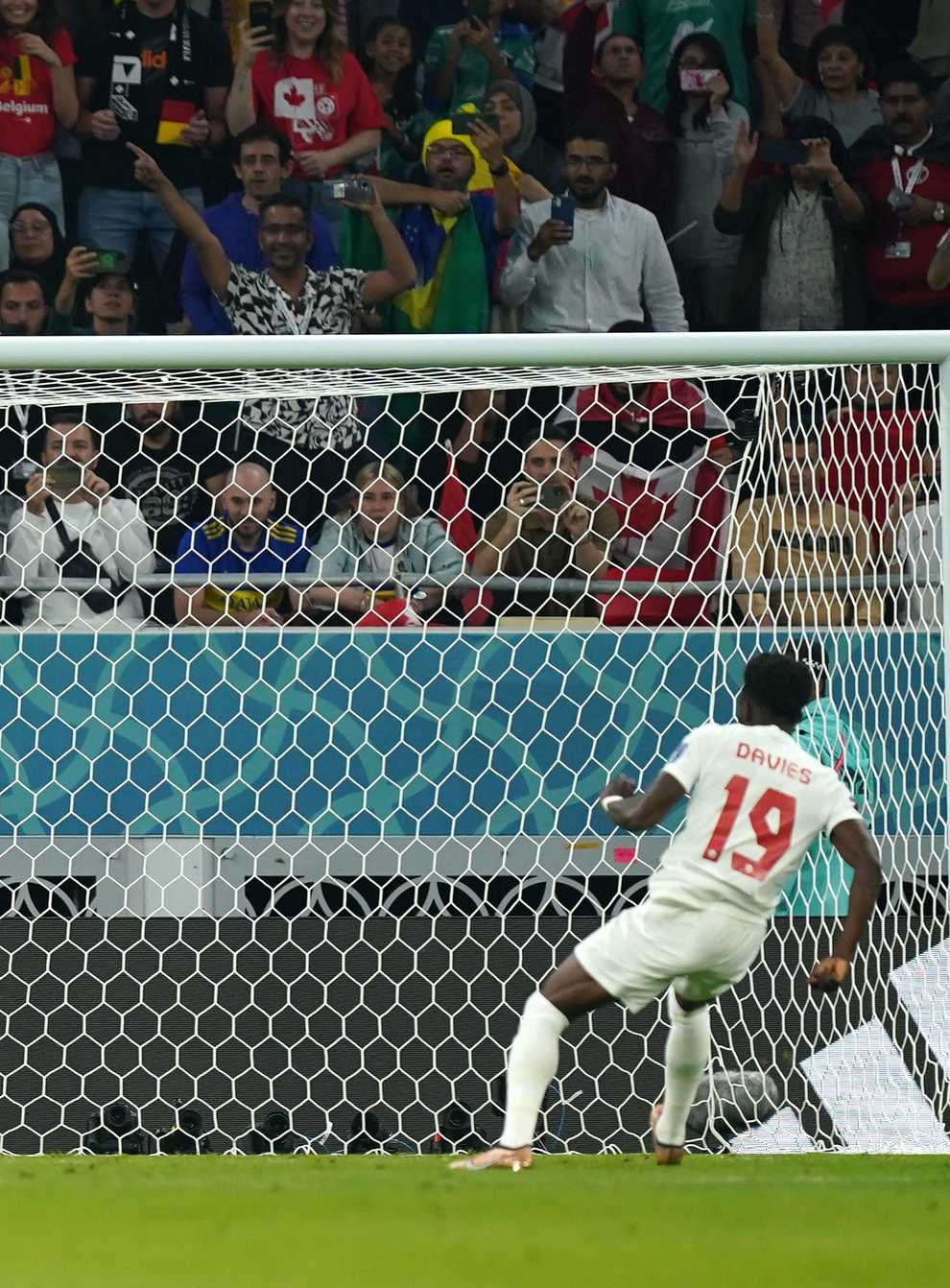 Alphonso Davies has a penalty saved by Belgium goalkeeper Thibaut Courtois (Mike Egerton/PA)