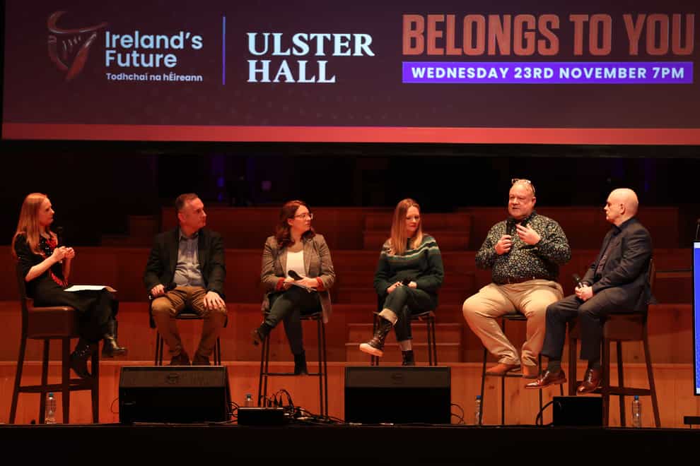 Glenn Bradley (second right) speaks during a rally for Irish unification organised by pro-unity group Ireland’s Future at the Ulster Hall in Belfast (PA)