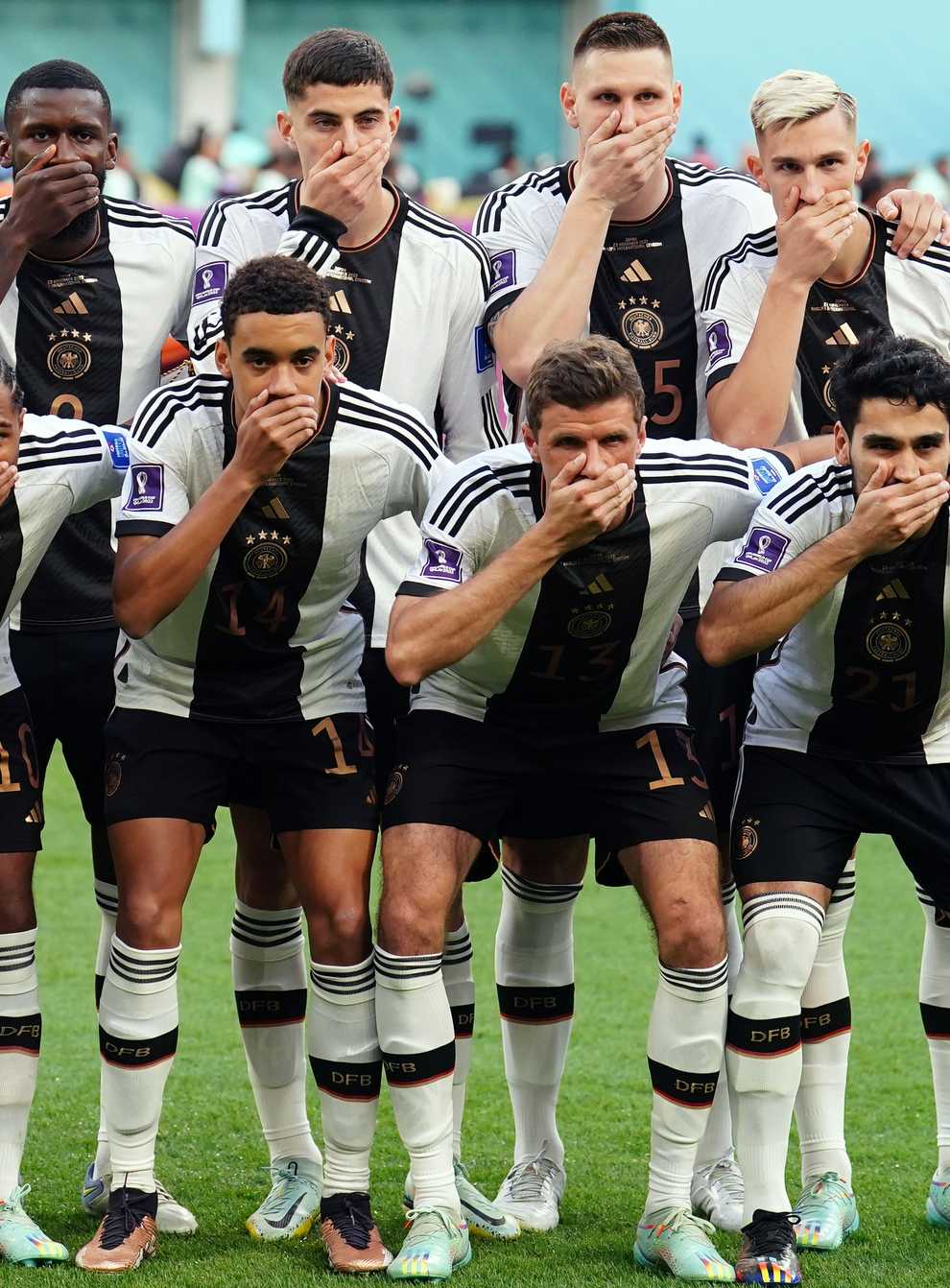 Germany players cover their mouths as a protest against FIFA (Mike Egerton/PA)