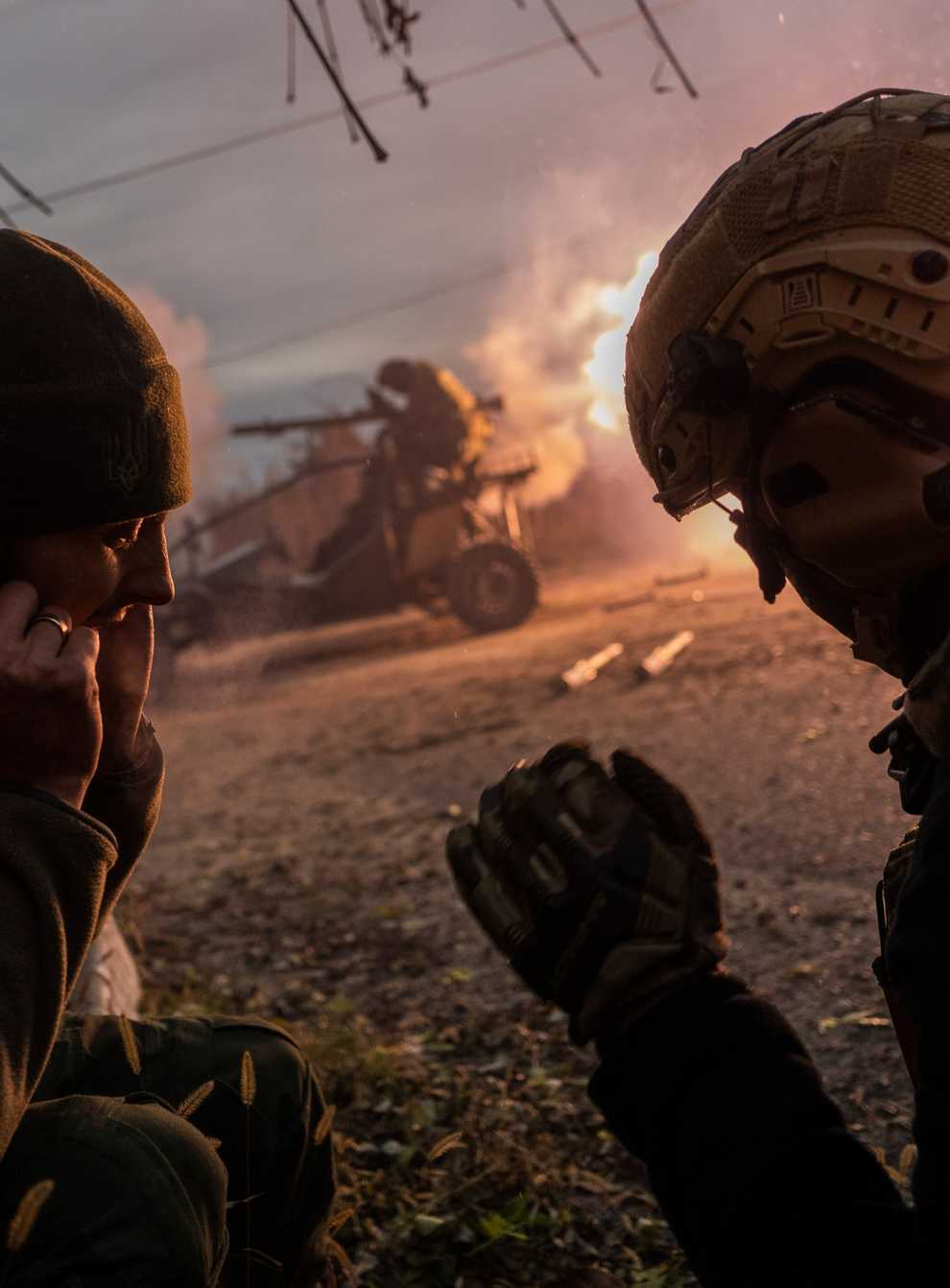 Ukrainian servicemen fire towards Russian positions in the frontline near Kherson, southern Ukraine (AP)