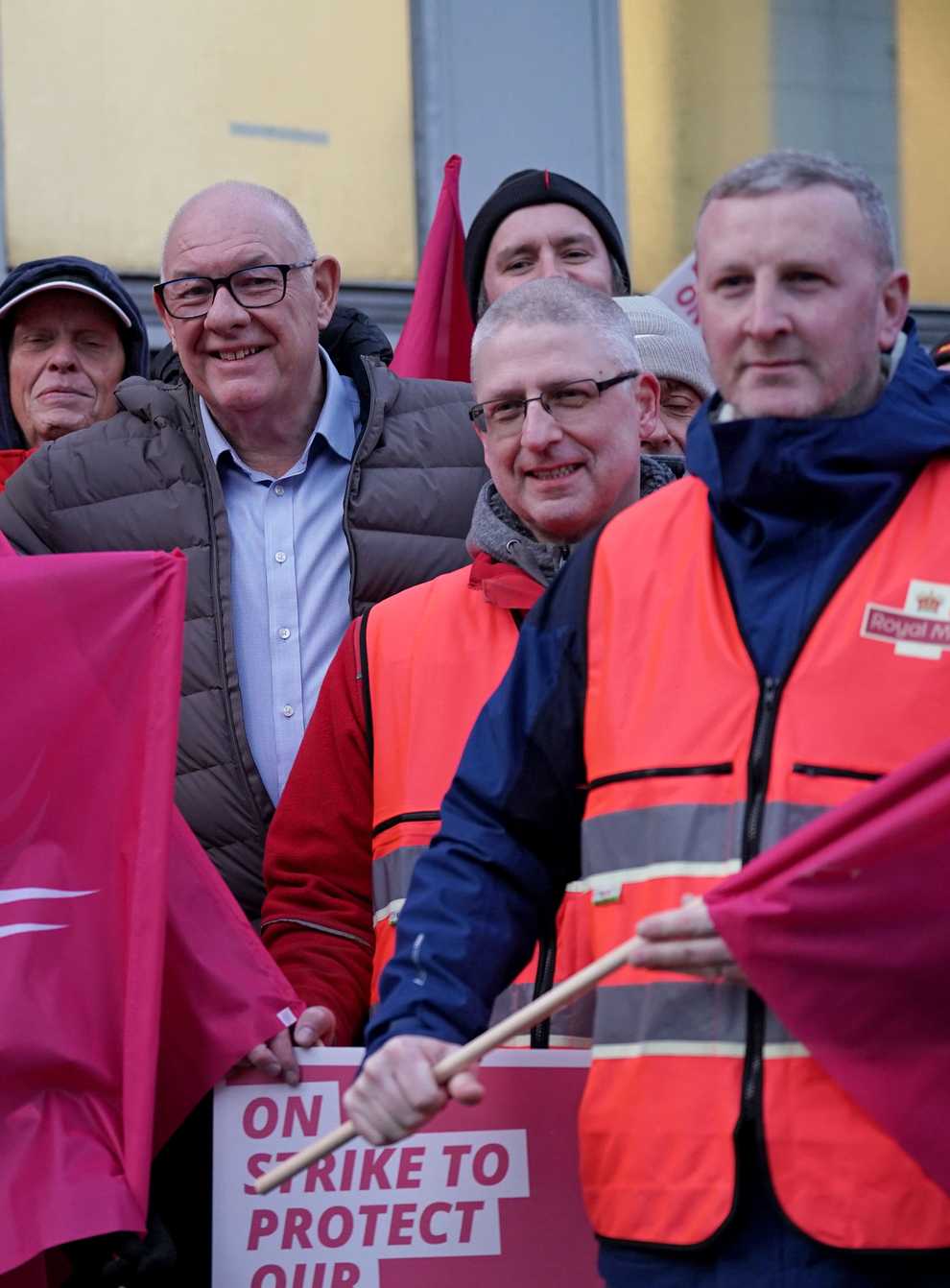 Communication Workers Union general secretary Dave Ward (centre) joins postal workers on the picket line in Camden, north London (Yui Mok/PA)
