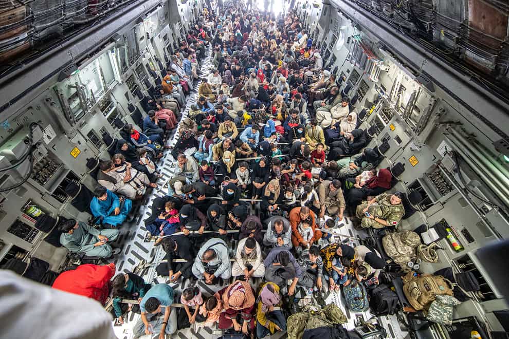 Refugees fly out of Kabul on an RAF plane (LPhot Ben Shread/MoD/PA)