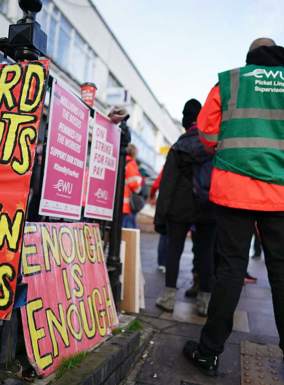 Royal Mail workers and university lecturers will continue with a strike on Friday in long running disputes over pay, pensions, jobs and conditions (Aaron Chown/PA)