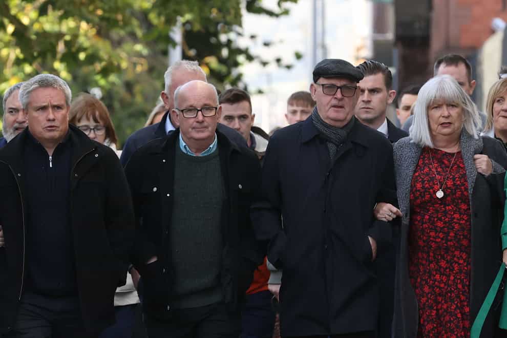 Family members of Aidan McAnespie, (left to right) cousin Brian Gormley, brothers Gerard and Sean and sister Margo, arrive at with supporters at Laganside Courts in Belfast, where former Grenadier Guardsman David Holden was found guilty (Liam McBurney/PA)
