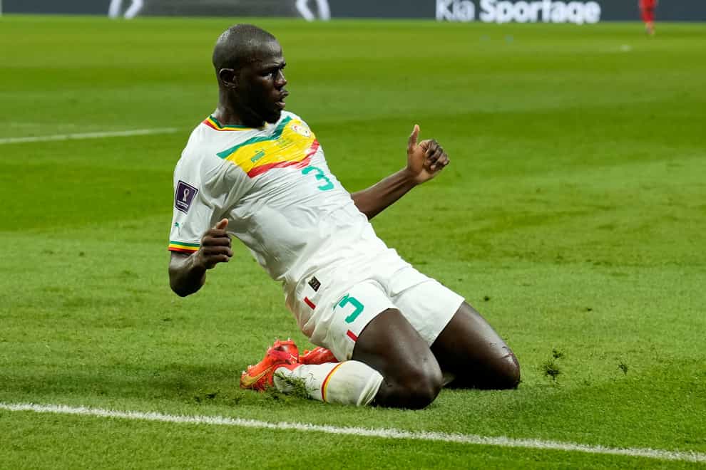 Senegal captain Kalidou Koulibaly scored his first international goal to help send his side into the knockout stage (Francisco Seco/AP)