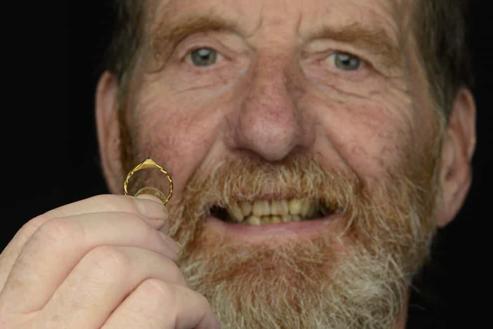 David Broad with the wedding ring given by Sir Thomas Brook to his wife Lady Joan Brook for their marriage in 1388 (Noonans/PA)