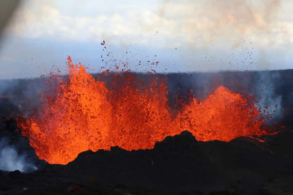 This aerial image courtesy of Hawaii Dept. of Land and Natural Resources shows lava flows on Mauna Loa, the world’s largest active volcano, on Wednesday, Nov. 30, 2022, near Hilo, Hawaii. (Hawaii Dept. of Land and Natural Resources via AP)
