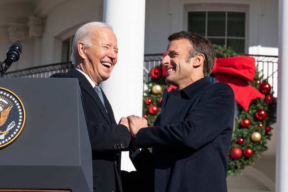 President Joe Biden welcomes French President Emmanuel Macron, right, during a State Arrival Ceremony on the South Lawn of the White House in Washington, Thursday, Dec. 1, 2022. (AP Photo/Alex Brandon)