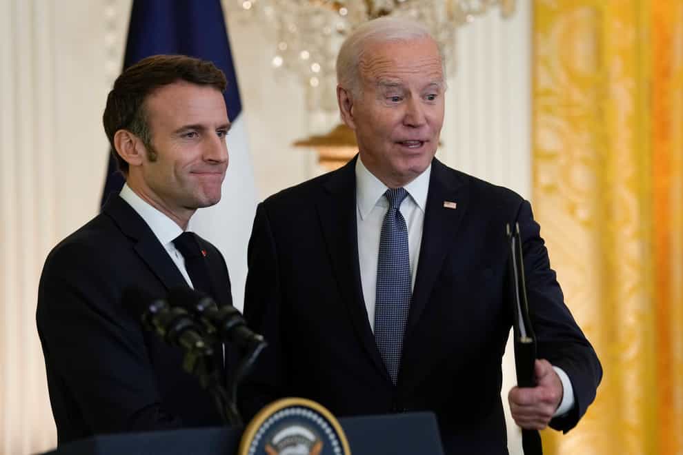 President Joe Biden shakes hands with French President Emmanuel Macron after a news conference in the East Room of the White House in Washington, Thursday, Dec. 1, 2022. (AP Photo/Susan Walsh)