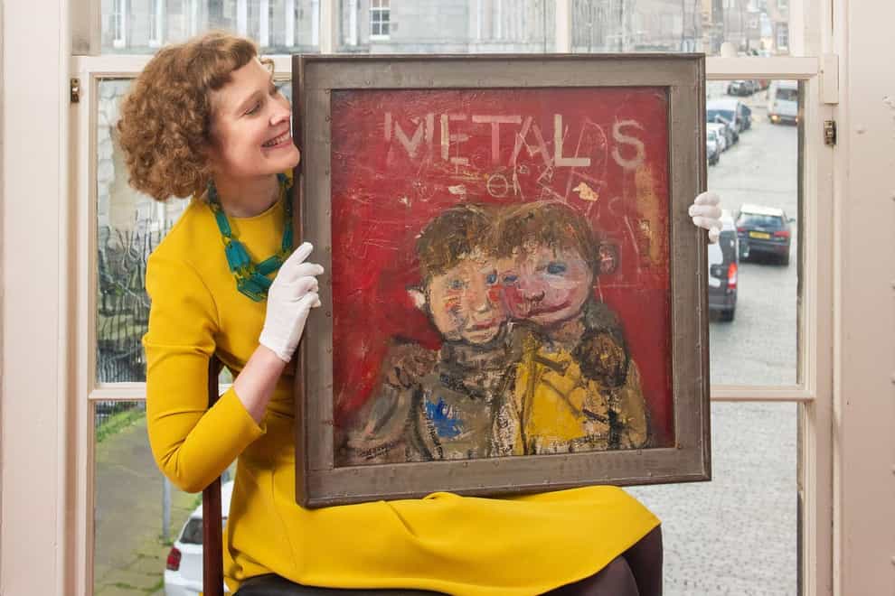 The Yellow Jumper will go under the hammer next week (Julie Howden/Lyon & Turnbull/PA)Alice Strange, Associate Director and Senior Specialist in Modern and Contemporary Art at Lyon & Turnbull with Joan Eardley’s The Yellow Jumper.This is one of the last paintings she made in her Townhead studio in Glasgow before she died aged only 42 in August 1963. Now it’s set to go under the hammer with fine art auctioneers Lyon & Turnbull in Edinburgh next Thursday (8 December).The painting, valued between £100,000 and £150,000, depicts two of the 12 Samson children, part of a family who lived near to Eardley’s studio.This important work, which has another painting of Glasgow tenements on the reverse, comes from an acclaimed series Eardley began in the early 1960s, depicting two children positioned in front of a bright red graffiti-covered wall. This relates directly to wording on the red wall of a scrap-metal business on the ground-floor beneath Eardley’s studio.