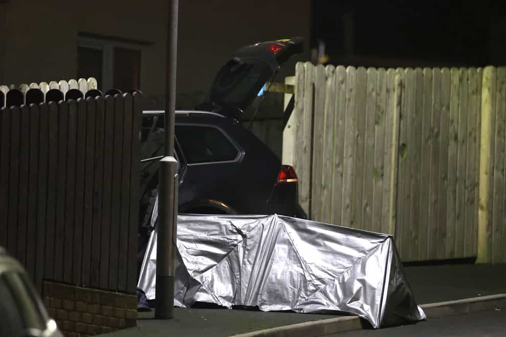 A tent erected next to a car at the scene of a fatal shooting in the Ardcarn Park area of Newry on Thursday evening (Liam McBurney/PA)