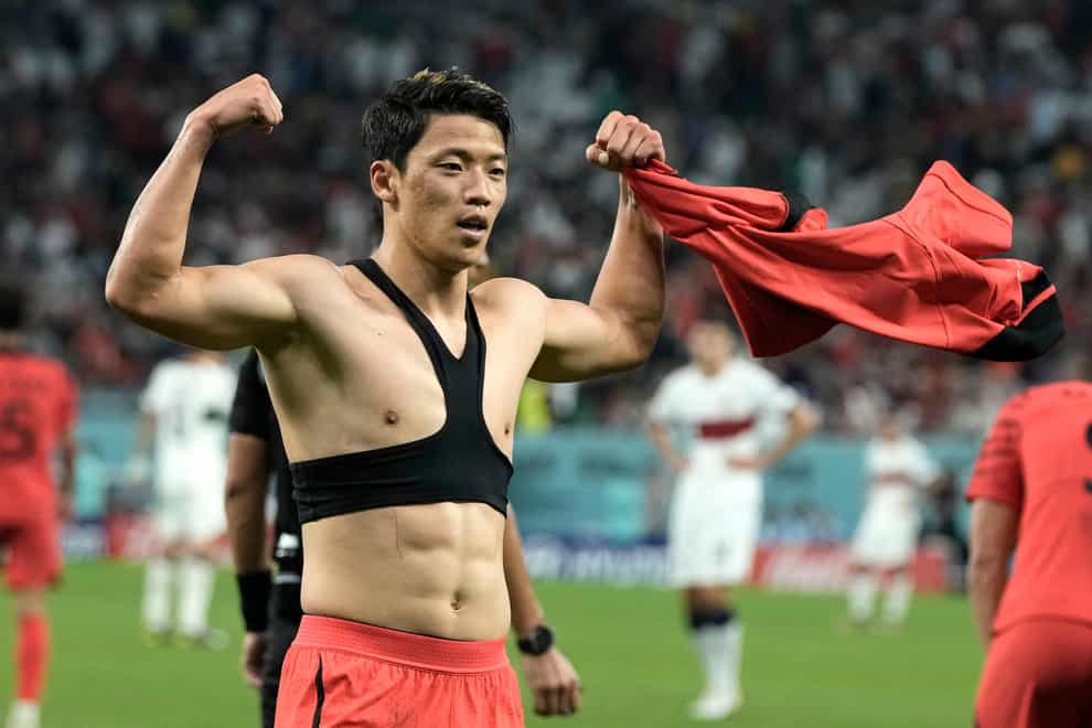 South Korea’s Hwang Hee-chan celebrates after scoring his side’s second goal (Hassan Ammar/AP)