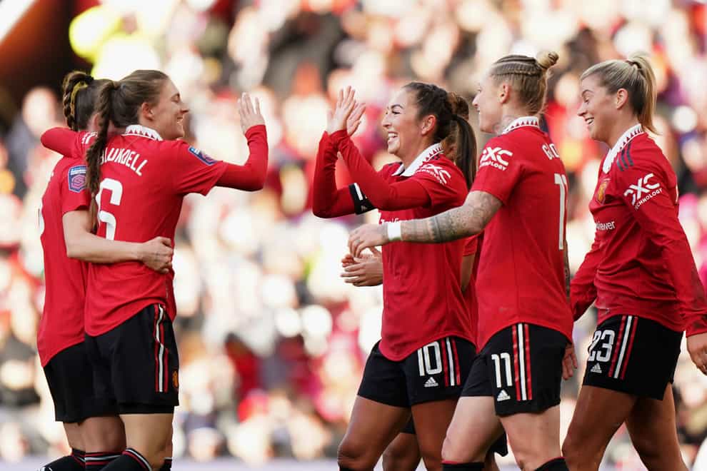Katie Zelem (centre) celebrates scoring Manchester United’s first goal with her team-mates (Tim Goode/PA)