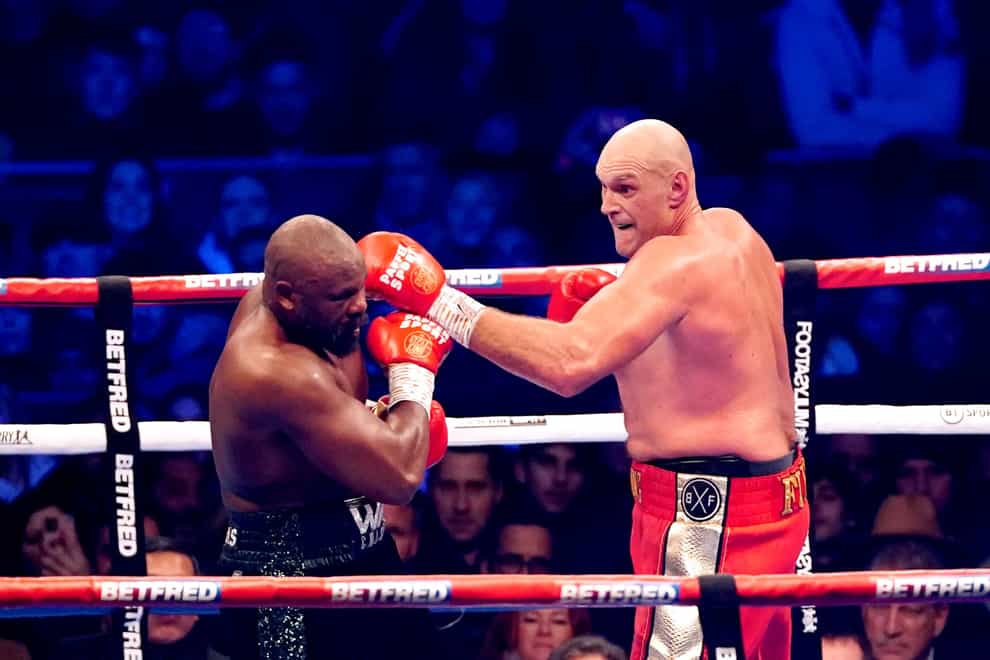 Tyson Fury (right) in action against Derek Chisora during their WBC World Heavyweight title fight at the Tottenham Hotspur Stadium, London. Picture date: Saturday December 3, 2022.