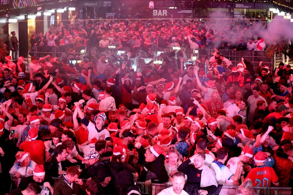England fans celebrate their third goal at Boxpark Wembley in London (PA)