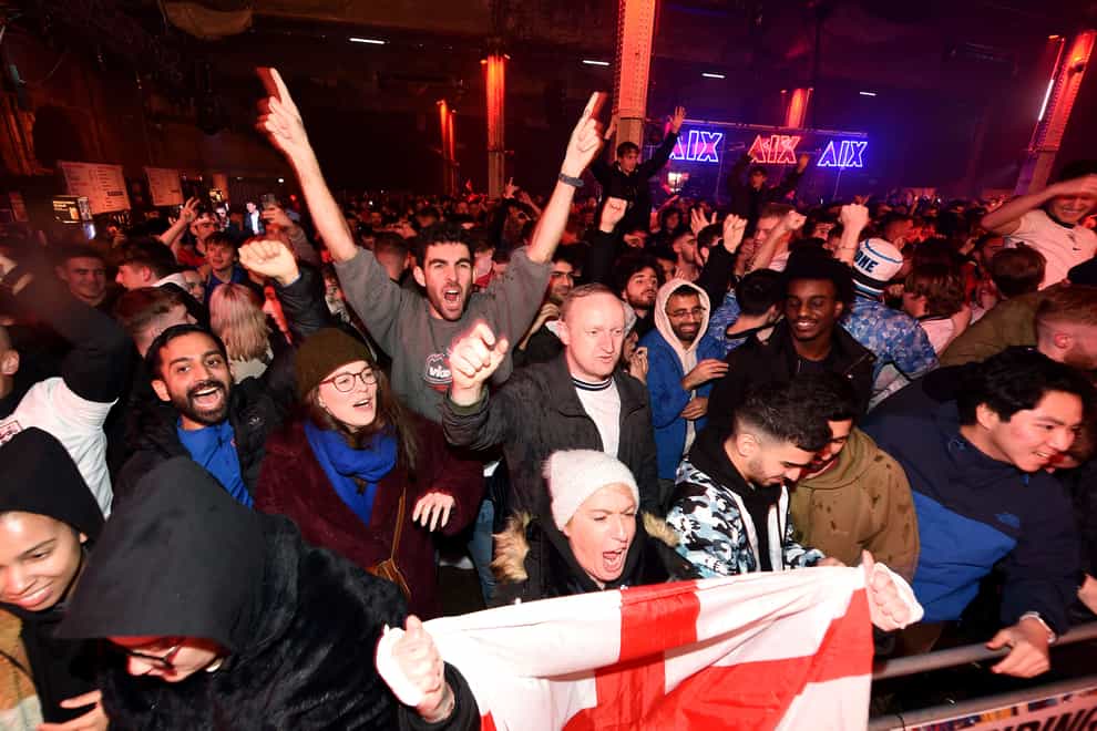 England fans at the Mayfield Depot in Manchester celebrate their side’s third goal in the 3-0 FIFA World Cup win over Senegal (Peter Powell/PA)