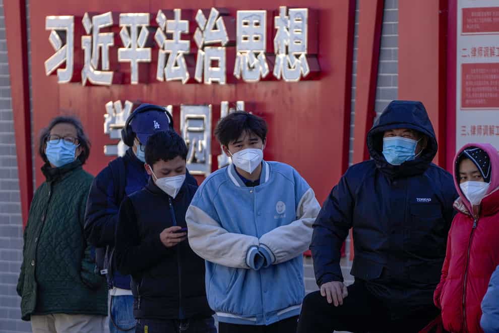 China is easing some of the world’s most stringent anti-virus controls, with authorities saying new variants of Covid-19 are weaker (Andy Wong/AP)