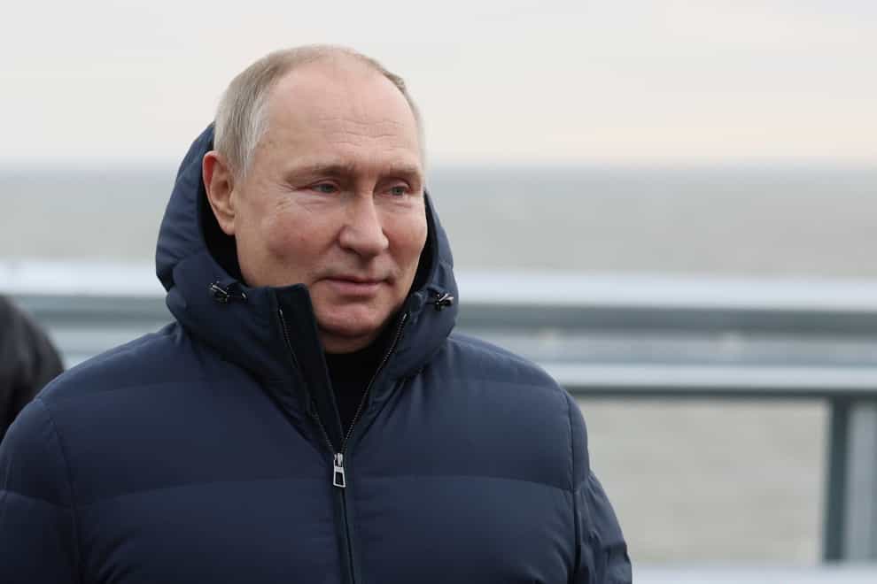 Russian President Vladimir Putin visits the bridge connecting the Russian mainland and the Crimean peninsula (Mikhail Metzel/Sputnik/Kremlin Pool Photo/AP)