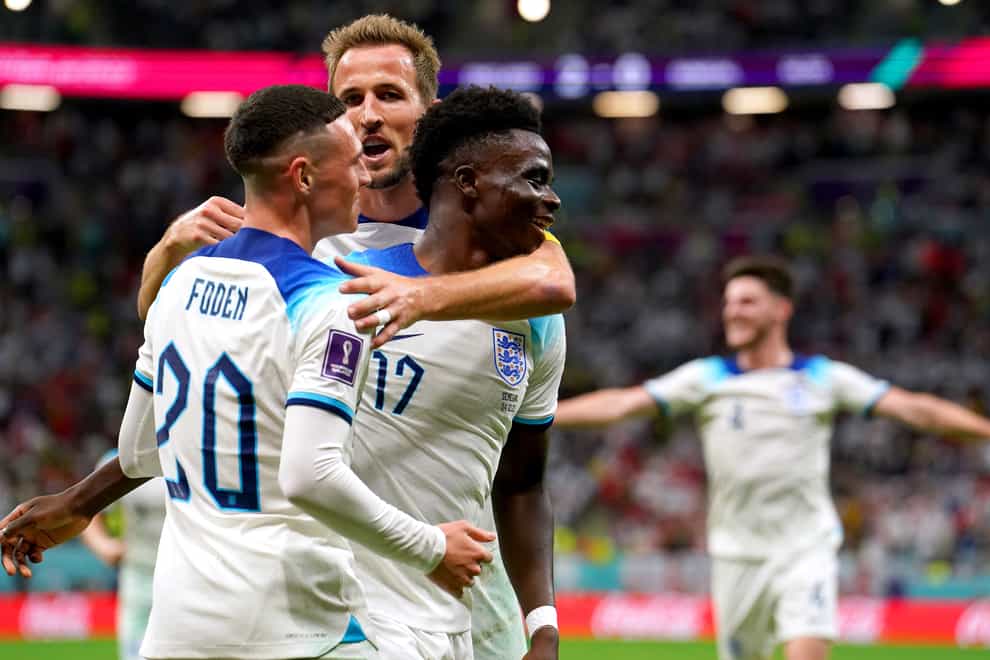 Harry Kane feels like a “proud older brother” to fellow England stars Bukayo Saka (right) and Phil Foden (left) (Martin Rickett/PA)