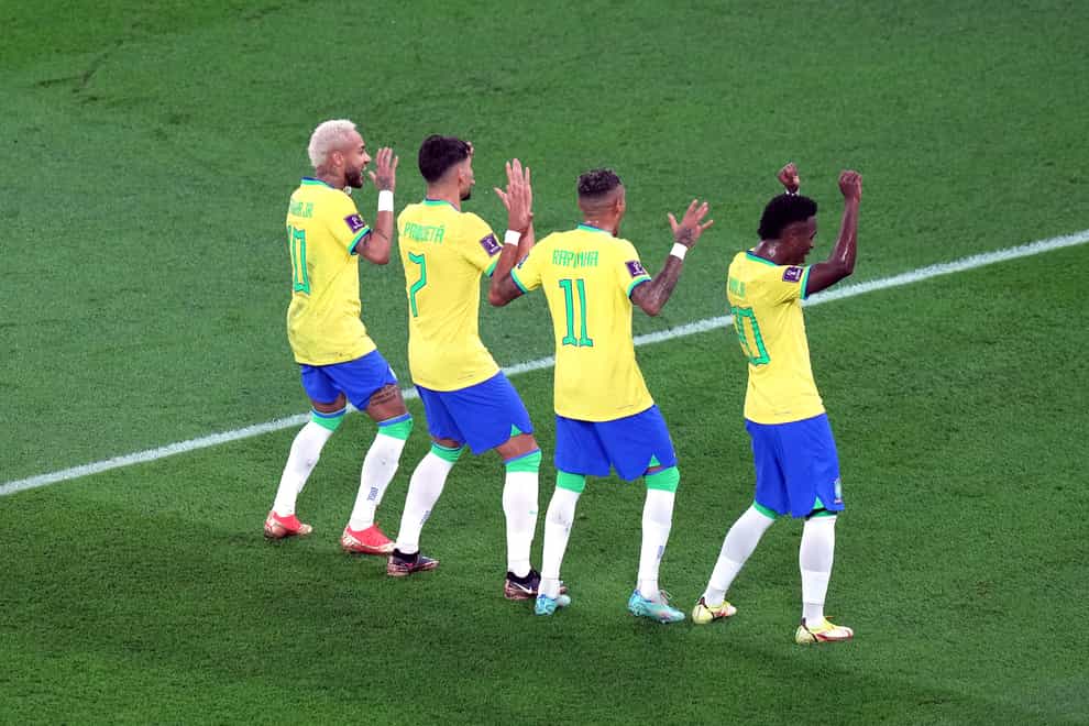 Neymar, left, celebrates his penalty (Peter Byrne/PA)