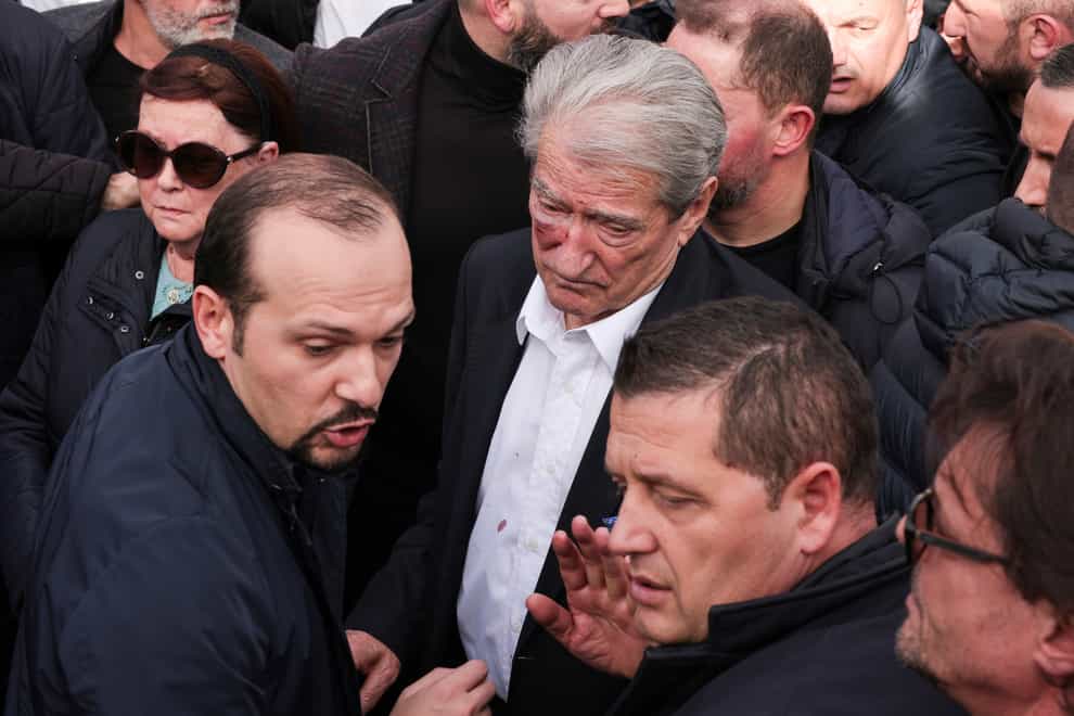 Sali Berisha after he was attacked during an anti-government protest held near a summit of European Union leaders (AP)