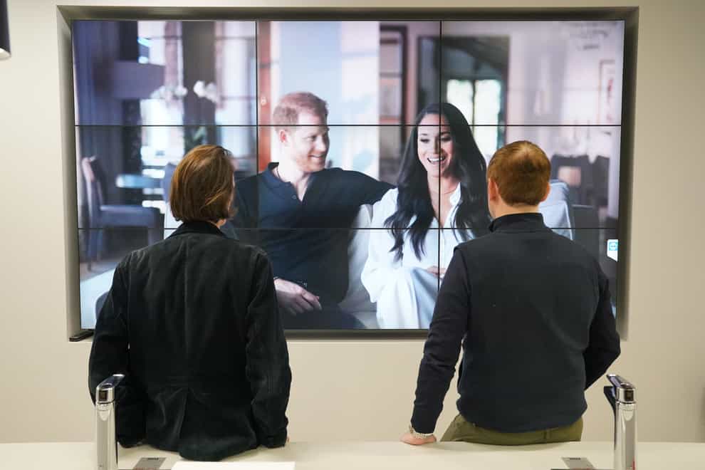 Office workers in London, watching the Duke and Duchess of Sussex’s controversial documentary (Jonathan Brady/PA)