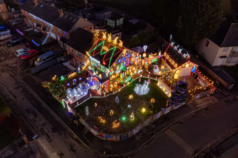 The display features dozens of figures including Santas, reindeer, snowmen and 50 rope-light shapes (Ben Birchall/PA)