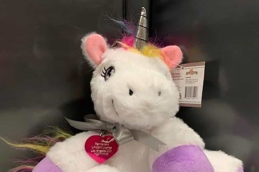 A toy unicorn, wearing a heart-shape tag (Los Angeles County Animal Care and Control via AP)
