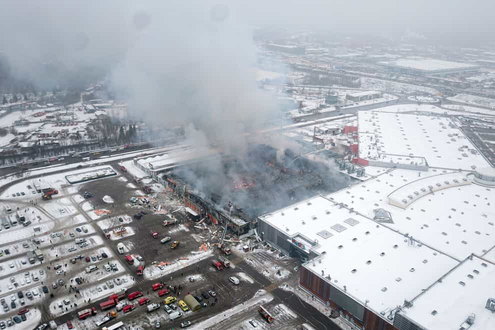Smoke rises from the OBI mall in Khimki (AP)