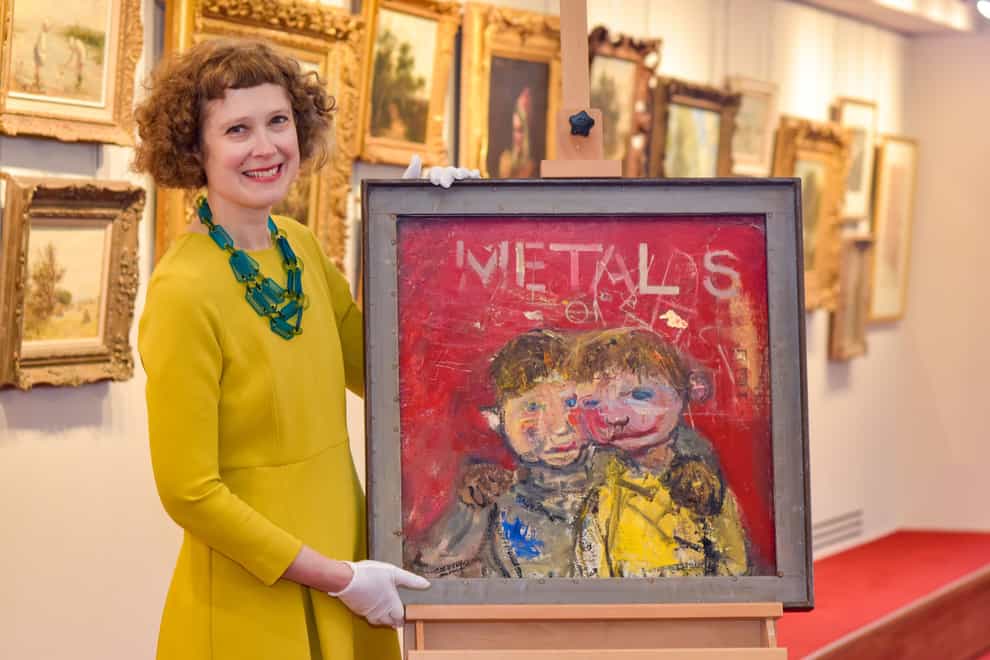 Alice Strang of auctioneers Lyon & Turnbull with Joan Eardley’s The Yellow Jumper painting, which sold for a record amount (Julie Howden/PA)