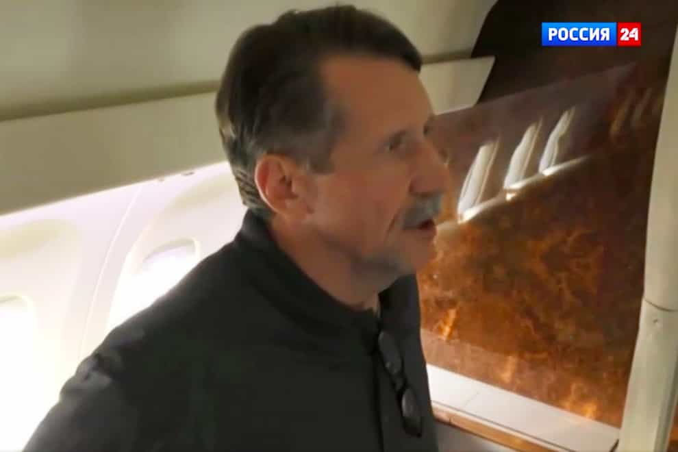 Viktor Bout speaks in a Russian plane after a swap, in the airport of Abu Dhabi (RU-24 Russian Television via AP)